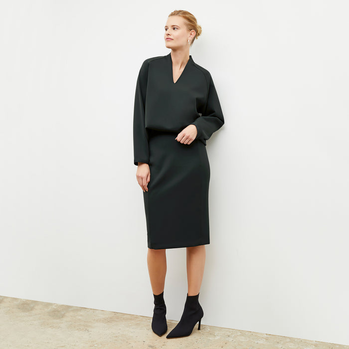 Image of a woman wearing the Chantal Skirt - Light Scuba in Forest