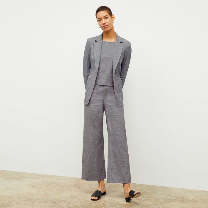 front image of a woman wearing the flaka top in gingham linen