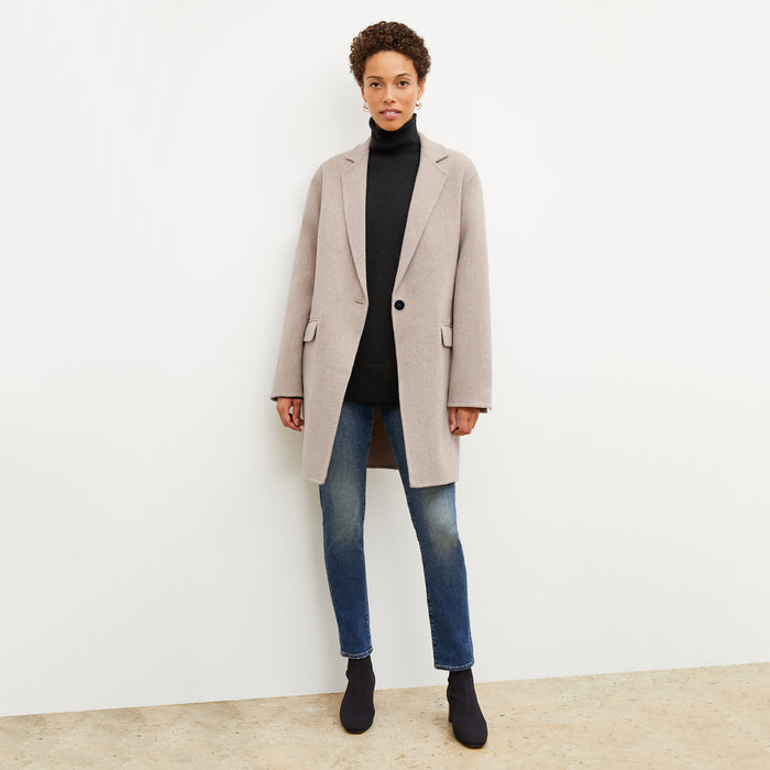 Front image of a woman wearing the lea sweater in black