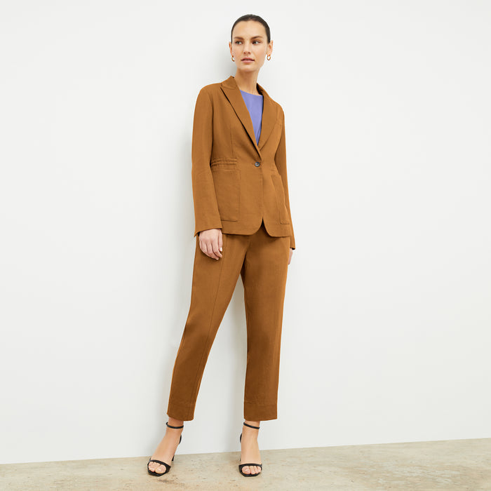Front image of a woman wearing the Nejvi Top in Iris