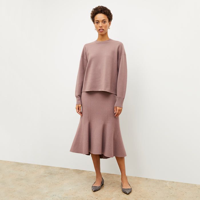 Front image of a woman wearing the quincy sweater in rose taupe