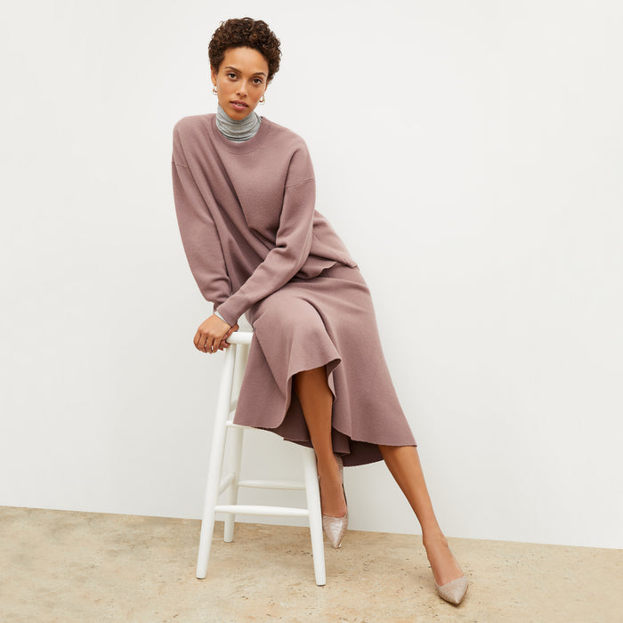 Front image of a woman wearing the quincy sweater in rose taupe