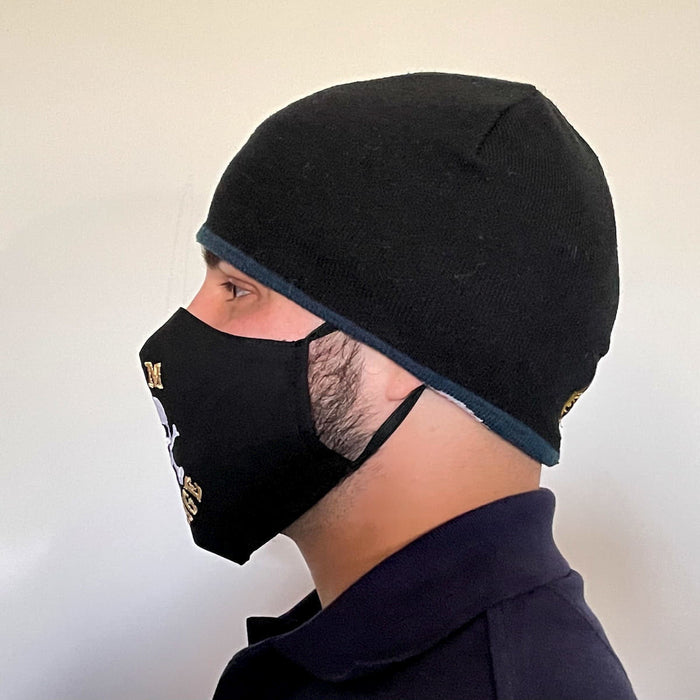 Side View of Black Cotton Face Mask with silk embroidered words Rum Storage, adjustable straps and pocket for disposable filter
