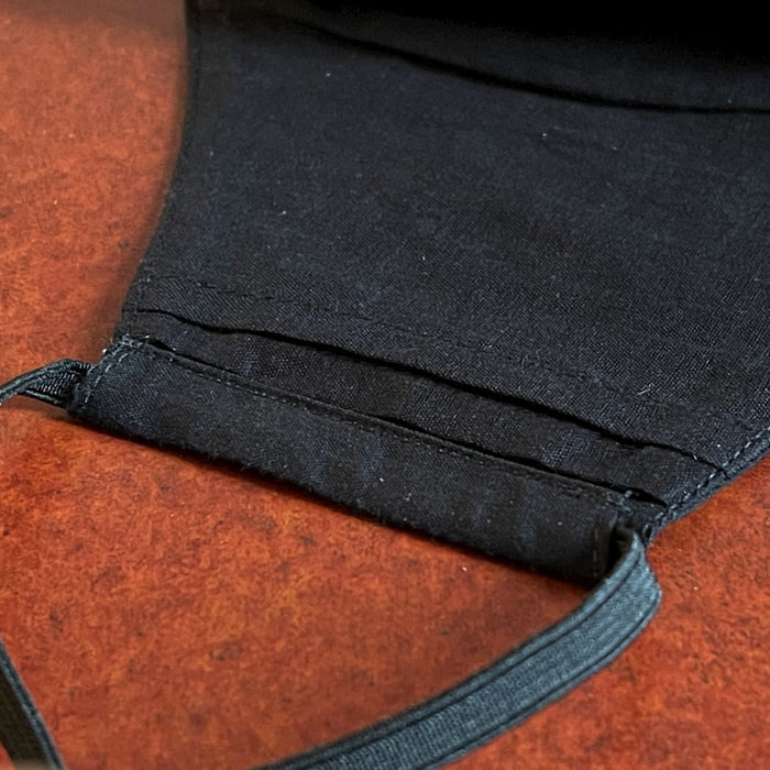 Black Cotton Rum Storage Face Mask has layers with a sleeve so you can insert an additional disposable filter