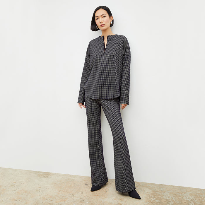 Front image of a woman wearing the tully top in black and white